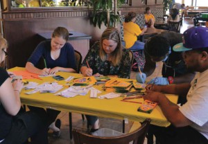 Coloring for a cause: Students meet in the MCC to color bookmarks for elementary students. The purpose of this event was to encourage younger children to read more.