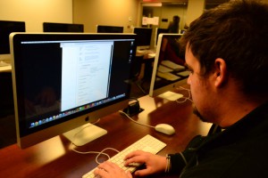 Supporting students: CU Junior Communication major Bradley Johnson looks over scholarship applications on the Cameron website. The Helen W. Holliday Foundation in Lawton has donated almost $520,000 in its 26 years of donations.