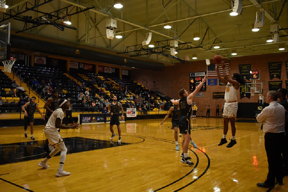 Men’s Basketball Takes First Win